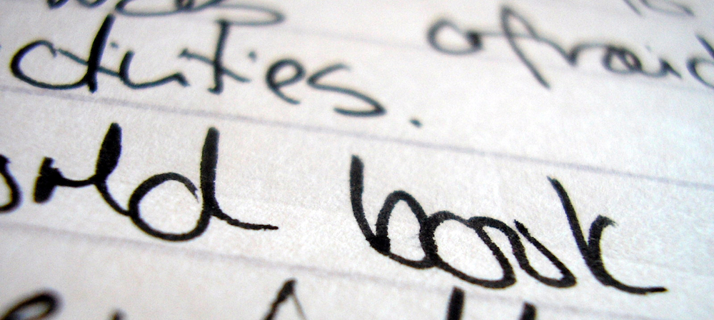 Words written in cusrive on paper